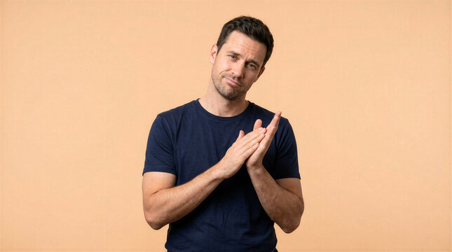 Man giving sarcastic slow clap with a skeptical expression on his face