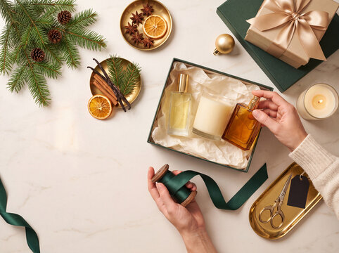 Holiday fragrance gift curation scene with layered scents