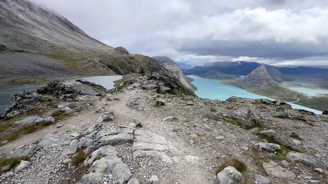 Walking the stony Besseggen trail above lake Gjende in Norway