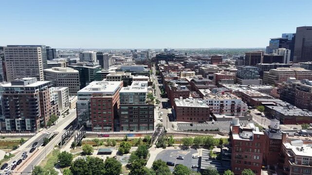 Aerial view of apartments and old historic buildings along the edge of Downtown Denver in Colorado on a clear sunny summer day. 