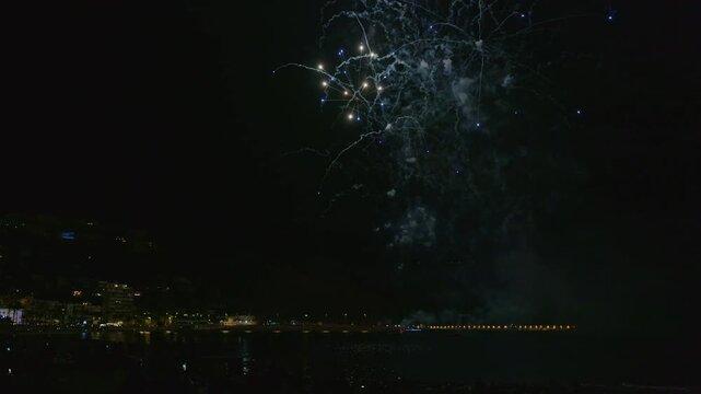 Spectacular night fireworks display over the sea in javea, spain