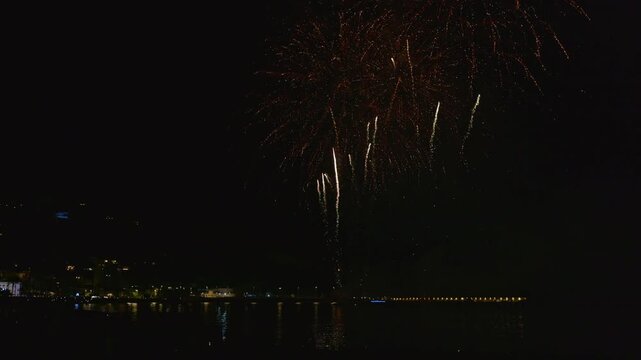 Spectacular night fireworks display over the sea in javea, spain