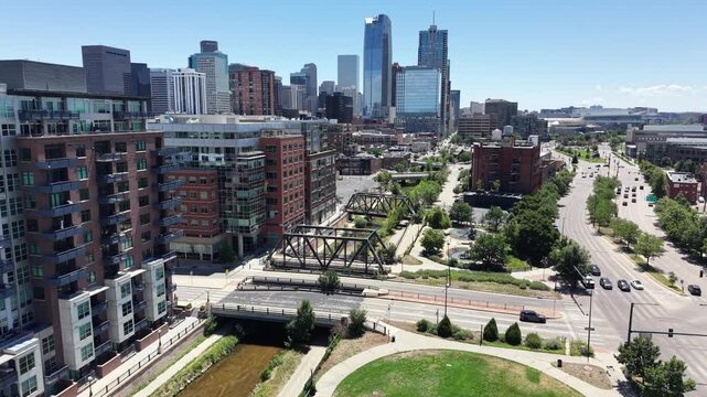 Aerial view flying along the Cherry Creek trail parallel to N. Speer Blvd in downtown Denver, Colorado. 