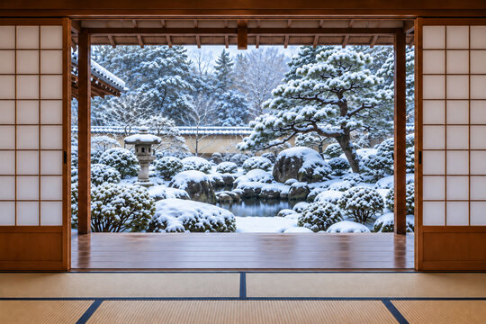 Traditional Japanese Tatami Room Overlooking a Snow-Covered Garden in Winter