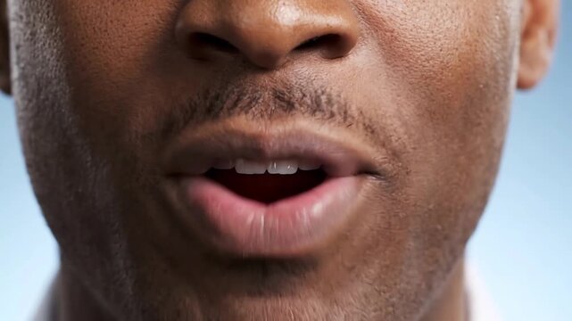 Close up of a handsome African American man smiling with perfect teeth
