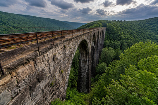 Old stone railroad bridge spanning a deep gorge in the Allegheny valley.