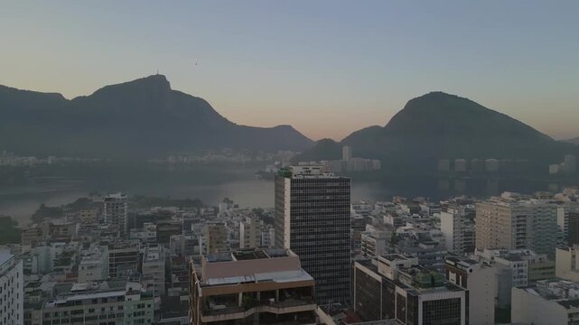 Twilight Aerial Left Panning View of Lagoa Rodrigo de Freitas With Christ the Redeemer Silhouette, Rio de Janeiro