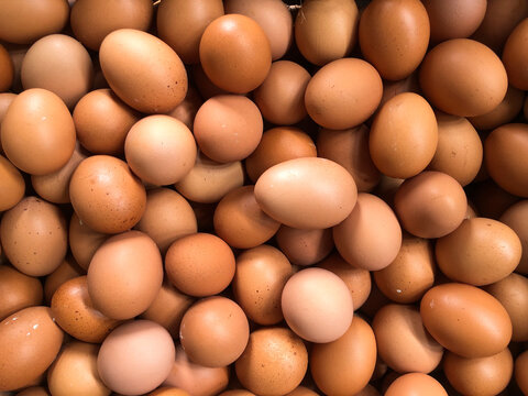 Organic egg texture and background. Raw chicken eggs. Pile of raw chicken eggs. Telur ayam (chicken egg). Top view. backgrounds
