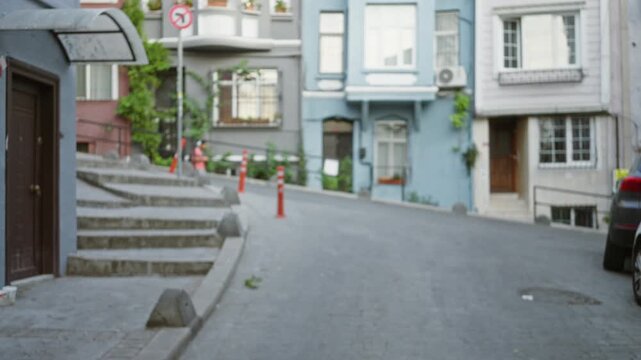 Istanbul street scene with soft blurred bokeh buildings, steps and cobblestone pavement; copyspace backplate virtual production.