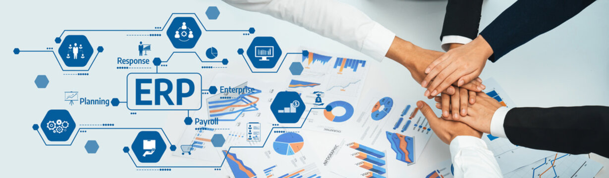 A group of diverse hands coming together to demonstrate collaboration over ERP strategy with visual data representations in a modern office setting. Amity