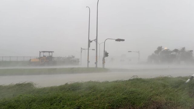Powerful Hurricane Winds Drive Torrential Rain Across Highway