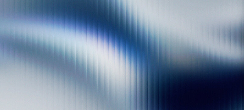Metallic silver and blue frosted glass panel texture with vertical fluted lines creating a sophisticated industrial abstract background design.
