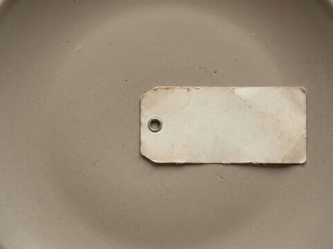 An expired completely blank date-label tag lying alone with no...