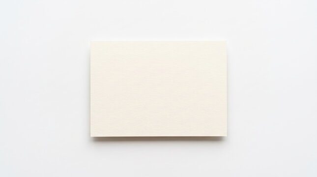 Blank cream colored paper card on simple neutral surface
