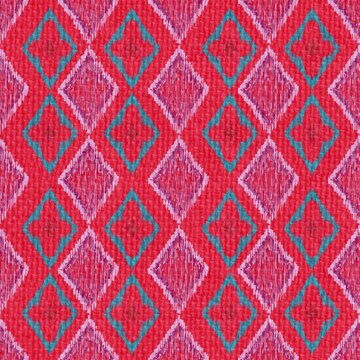A vibrant and colorful seamless geometric pattern featuring traditional ikat style motifs in striking shades of red, turquoise, and pink. Ideal for textile printing, fashion apparel, wrapping paper.