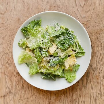 Fresh caesar salad with romaine lettuce croutons and grated parmesan cheese green salad lunch bowl