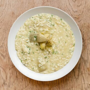 Creamy mushroom risotto served on a white plate with creamy rice italian cuisine homemade dinner