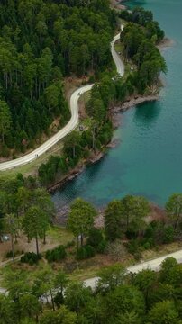 Lake Doxa Road Winding Through Forests In Feneos, Corinthia, Greece