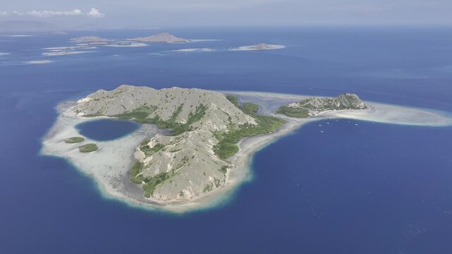 Aerial view of the Pungu Besar coral reef coastline in East Nusa Tenggara Islands, Komodo, Indonesia