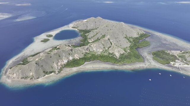 Aerial view of the Pungu Besar coral reef coastline in East Nusa Tenggara Islands, Komodo, Indonesia