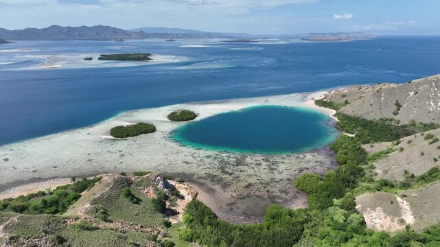 Aerial view of the Pungu Besar coral reef coastline in East Nusa Tenggara Islands, Komodo, Indonesia