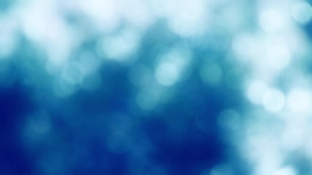 雪や水に反射して輝く冬の木漏れ日と、寒色系の玉ボケ背景動画