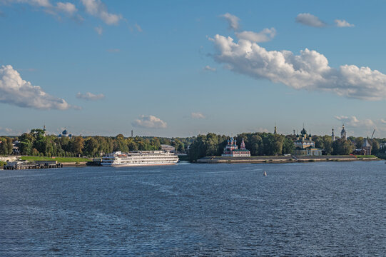 Cruise ships at the pier in the ancient Russian city of Uglich on background of Uglich Kremlin.