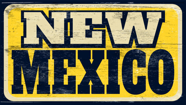 Aged and worn New Mexico sign on wood