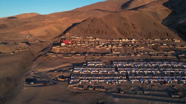 Aerial view of Peiku Tso Lake and Shishapangma Peak with Lapu Village in Tibet