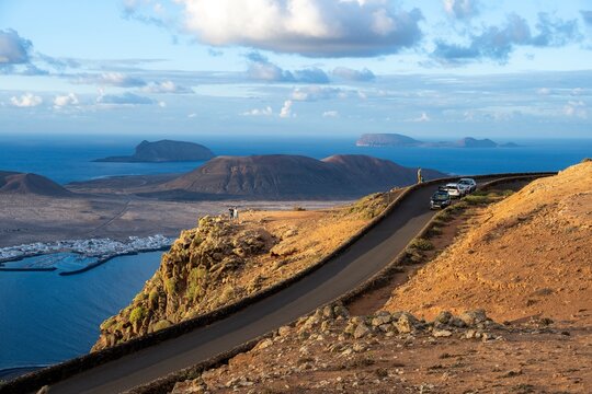Road on the coast, back island of La Graciosa, Mirador del Porrito viewpoint at sunset, Lanzarote, Canary Islands, Spain