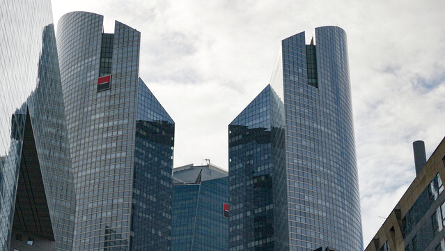 PARIS, FRANCE - SEPTEMBER 1, 2026 - Tours Societe Generale standing tall in the cloudy Parisian business district La Defense