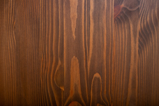 Rich brown wood grain forms a natural backdrop for various design applications
