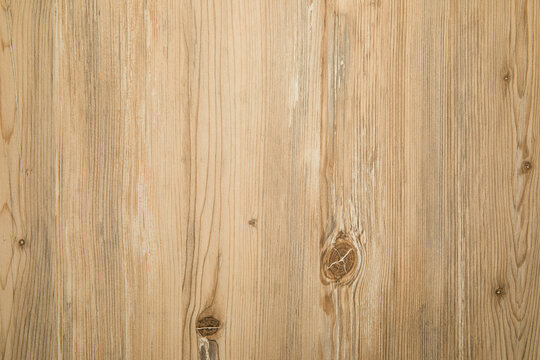 Light wood backdrop displays natural grain and texture for diverse projects
