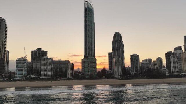 Golden sunset light across the Surfers Paradise beachfront skyline, aerial view, Gold Coast, Queensland Australia