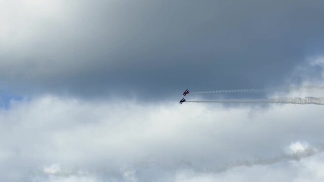 Aerobatic Biplanes Performing Formation Flying with Smoke Trails at Gold Coast