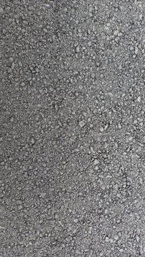 rough and granular texture of the road asphalt