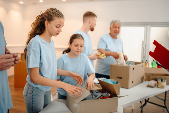 Volunteers sorting donations for community charity work