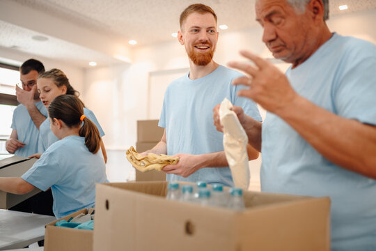 Volunteers sorting donations for community charity work