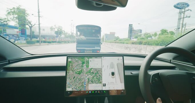 Business asian woman drive EV car use GPS navigator trnasport technology