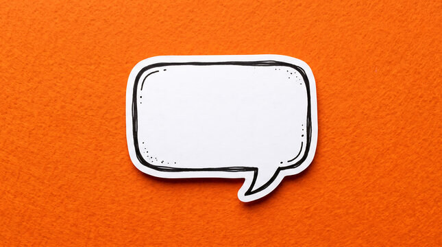 Speech bubble cutout paper shape on a bright orange background