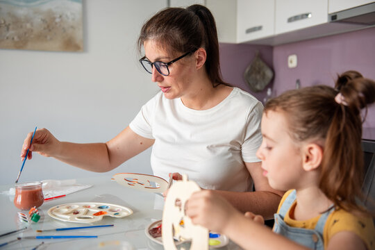 Mother and daughter make DIY Halloween decorations at home