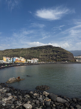 Colourful houses at the black sand beach of Puerto de Tazacorte on La Palma, Canary Islands, Spain.