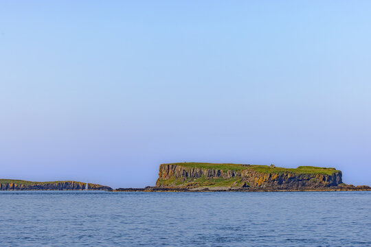 View from the sea onto Cairn na Burgh Mor and the Treshnish Isles, islands in the Inner Hebrides, off the west coast of the Isle of Mull in Scotland.