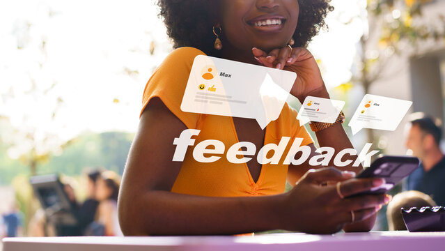 User interacts with mobile phone while receiving feedback at outdoor event during day