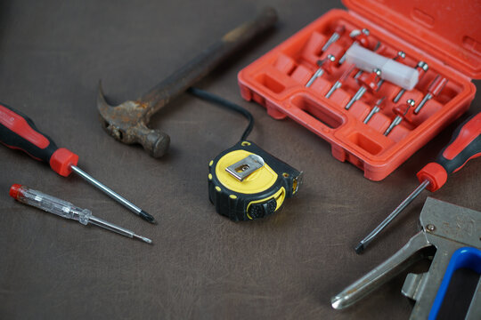 Hand tools and socket set on workshop table