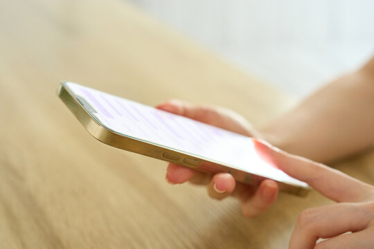Young Womans Hand Holding Smartphone While Texting