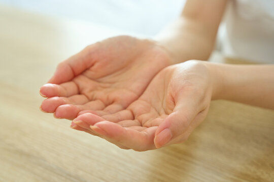 Young Womans Cupped Hands Offering With Gratitude