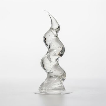 Abstract transparent liquid sculpture with swirl shape on white background clear fluid water splash abstract form liquid movement fluid art dynamic liquid