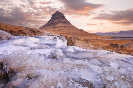 Beautiful landscape of Kirkjufellsfoss with background of remark