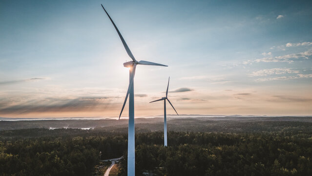 Aerial view of wind turbines over forest at sunrise, Vinalhaven, Maine